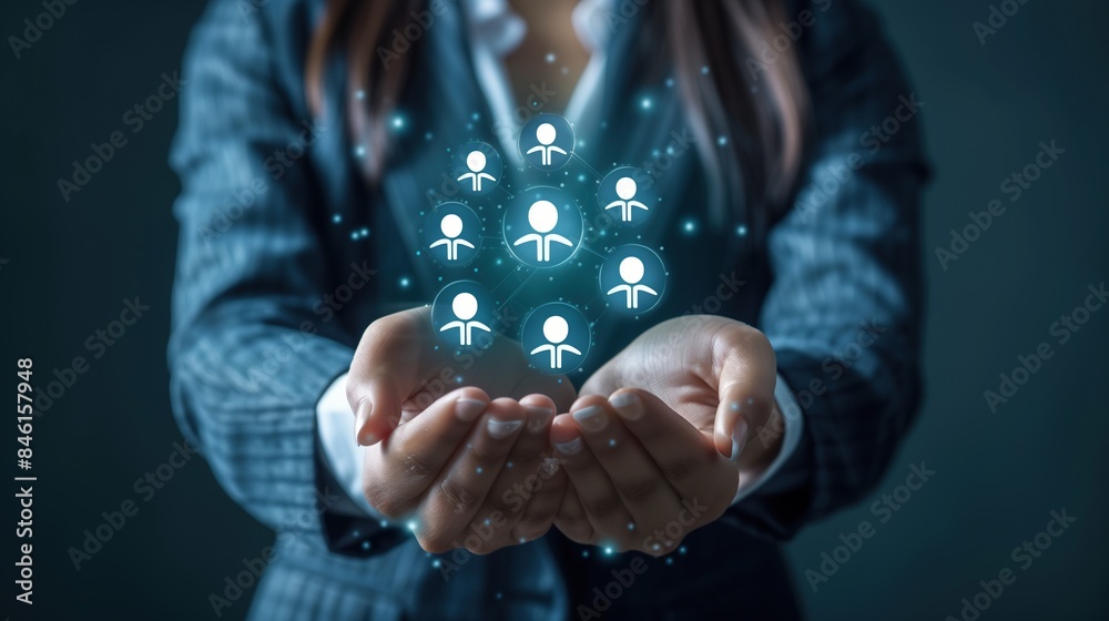 A businesslady is holding a network of digital human resource icons A businesslady is holding a network of digital human resource icons