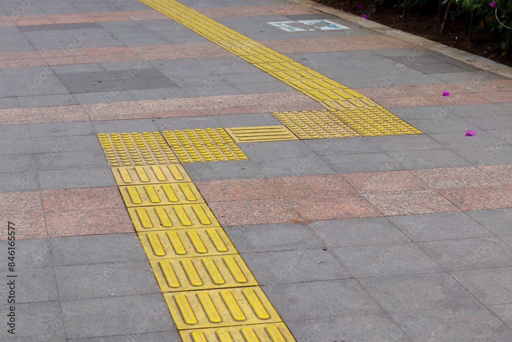 Installation of guiding block patterns for safe turning, enhancing ...