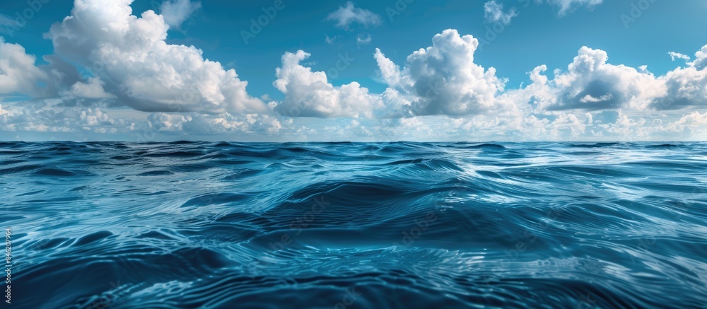 Surface of blue sea or ocean and underwater vistas beneath sunny and cloudy skies Surface of blue sea or ocean and underwater vistas beneath sunny and cloudy skies
