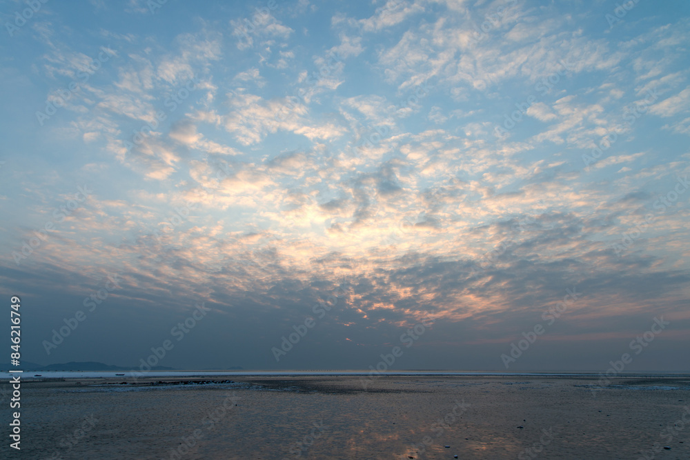 View of the sunset on the beach in winter View of the sunset on the beach in winter