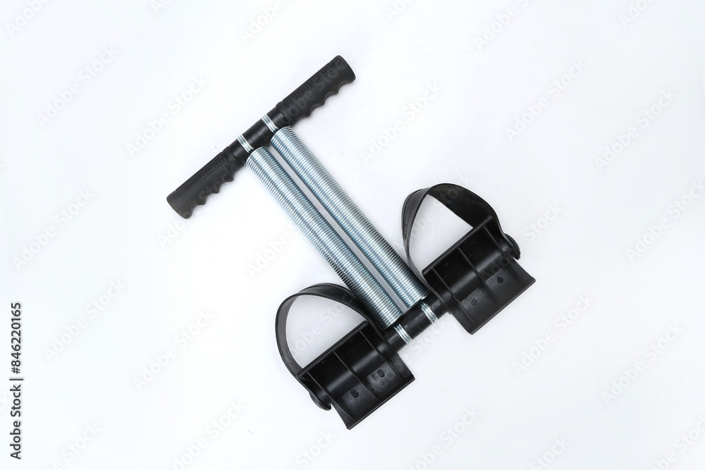 Double Spring Tummy Trimmer For Abs Workout Bicep Shoulder Exerciser isolated on white background Double Spring Tummy Trimmer For Abs Workout Bicep Shoulder Exerciser isolated on white background