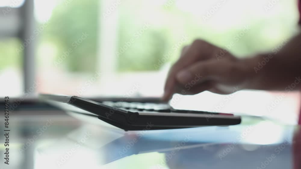 Manual calculator Financial calculations with a calculator Close-up of a finger-press calculator, person typing on a keyboard Manual calculator Financial calculations with a calculator Close-up of a finger-press calculator, person typing on a keyboard