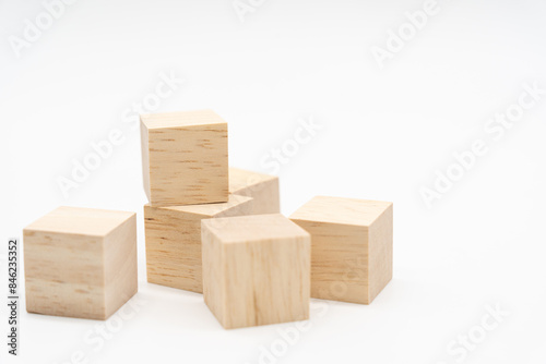 Wooden cube or wooden blocks isolated on a white background. Pile of wood block. Copy, empty space for text.