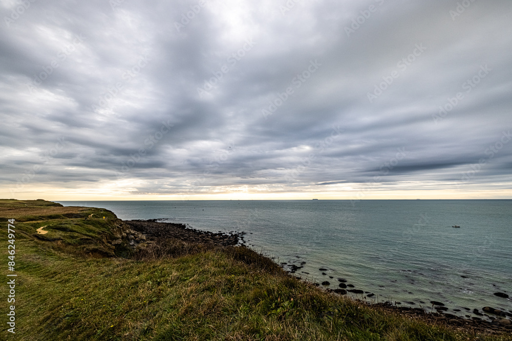 Experience the rugged coastline, dramatic sky, and serene sea, creating a tranquil setting that soothes the senses Experience the rugged coastline, dramatic sky, and serene sea, creating a tranquil setting that soothes the senses