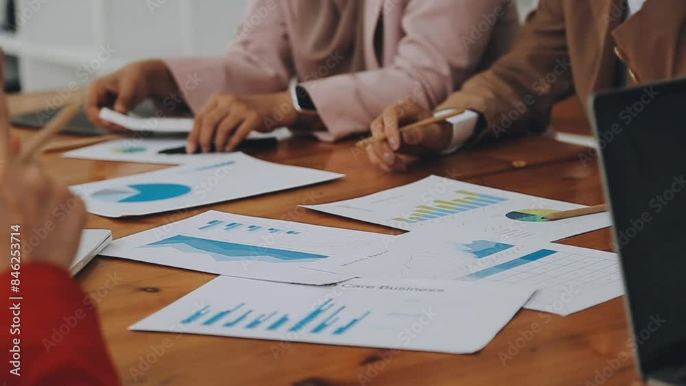 Team of business people are meeting to analyze data for marketing plan,Market research reports and income statistics, Financial and Accounting concept. Team of business people are meeting to analyze data for marketing plan,Market research reports and income statistics, Financial and Accounting concept.