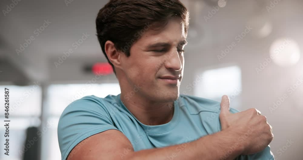 Man, shoulder and injury with pain at gym for accident during workout, exercise or training. Frustrated male person with sore ache, joint or inflammation from muscle tension or strain at health club