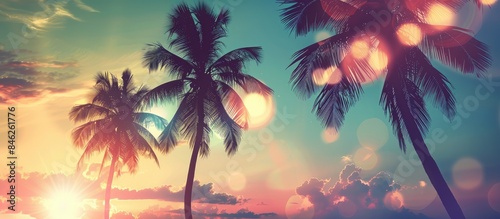 Palm Trees Silhouetted Against Sunset Sky - Vintage Summer Getaway Enhanced with Bokeh Lights