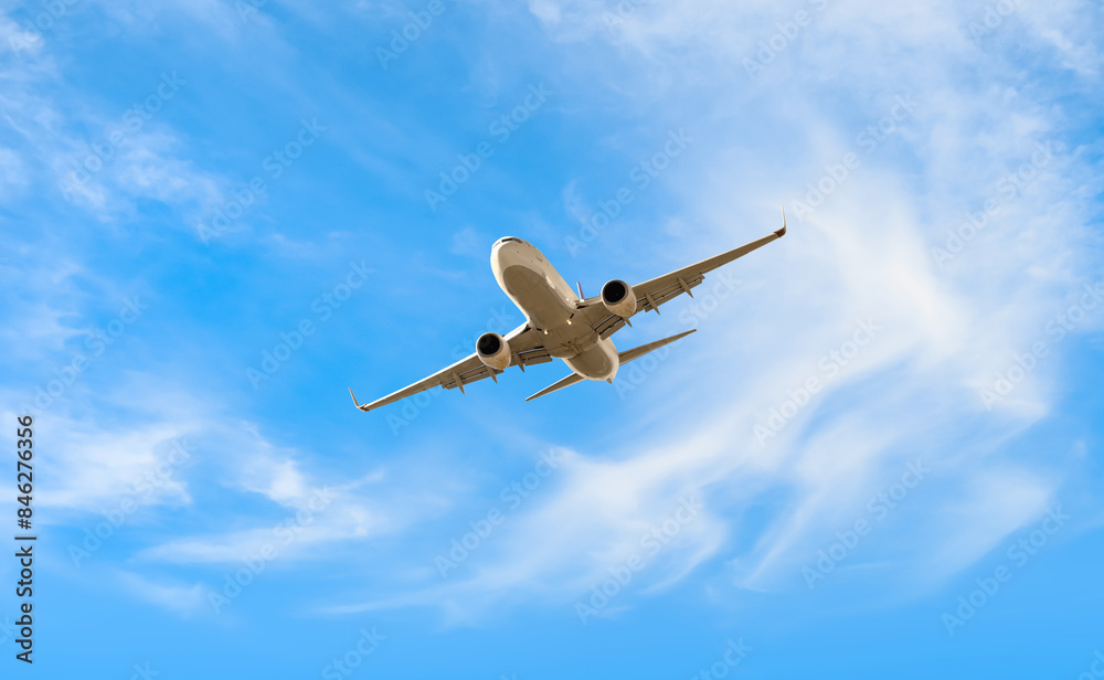 White passenger airplane flying in the sky amazing clouds in the background - Travel by air transport White passenger airplane flying in the sky amazing clouds in the background - Travel by air transport