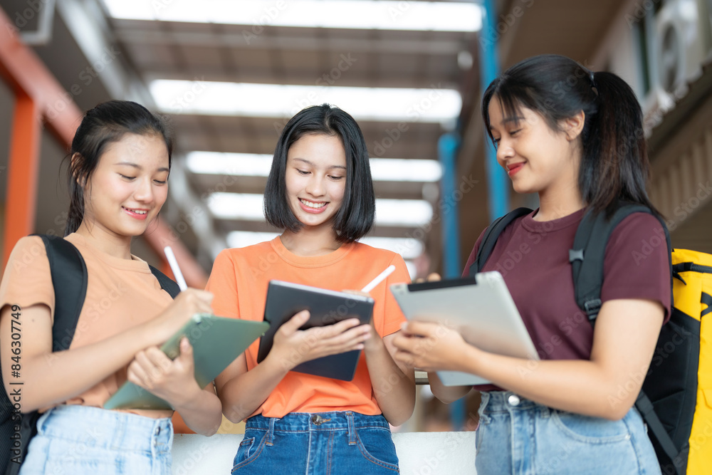 High school girls from Asia, gathered in study groups, are a common sight in the university library, where they engage in collaborative learning and knowledge sharing to excel in exams. High school girls from Asia, gathered in study groups, are a common sight in the university library, where they engage in collaborative learning and knowledge sharing to excel in exams.