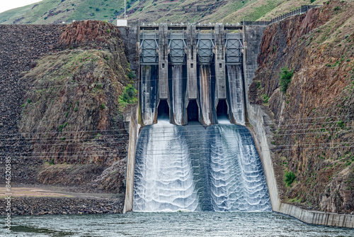 Water cascades down the spillway of Brownlee Dam on the Snake River in Idaho, USA