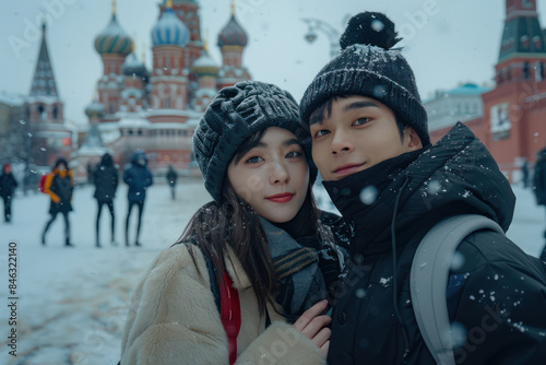 Romantic Winter Vacation at Iconic Landmark with Snow Covered Scenery and Cozy Outfits for Couples photo