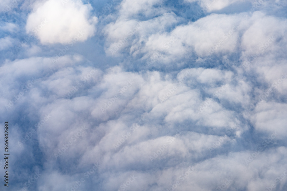 Clouds photographed from an airplane,Cumulus clouds are clouds that have flat bases and are often described as puffy, cotton-like, or fluffy in appearance. Honolulu to Lihue Clouds photographed from an airplane,Cumulus clouds are clouds that have flat bases and are often described as puffy, cotton-like, or fluffy in appearance. Honolulu to Lihue