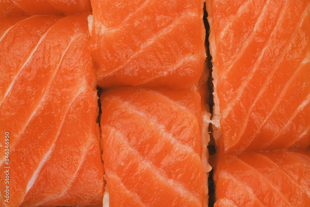 A close-up image of freshly made salmon sushi rolls A close-up image of freshly made salmon sushi rolls