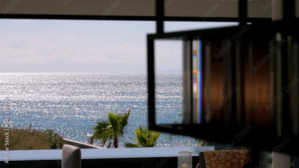 Slow motion revealing shot of a beautiful sea view from a villa in Sete, France