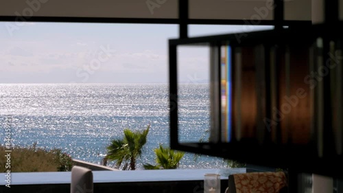 Slow motion revealing shot of a beautiful sea view from a villa in Sete, France