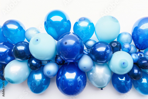 A bouquet of balloons in various shades of blue, from light to dark, arranged in an ombre pattern against a white background.