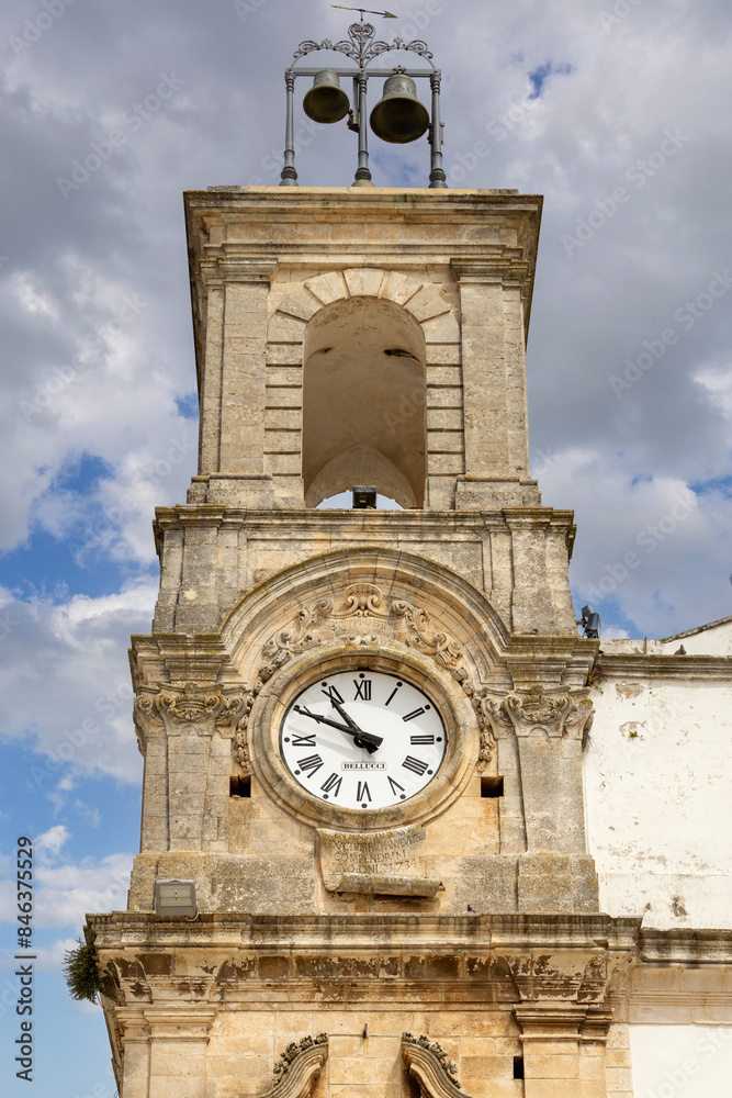 Civic Tower (Torre dell'Orologio) next to University Palace, located in Plebiscito Square, Martina Franca, Italy, Apulia
