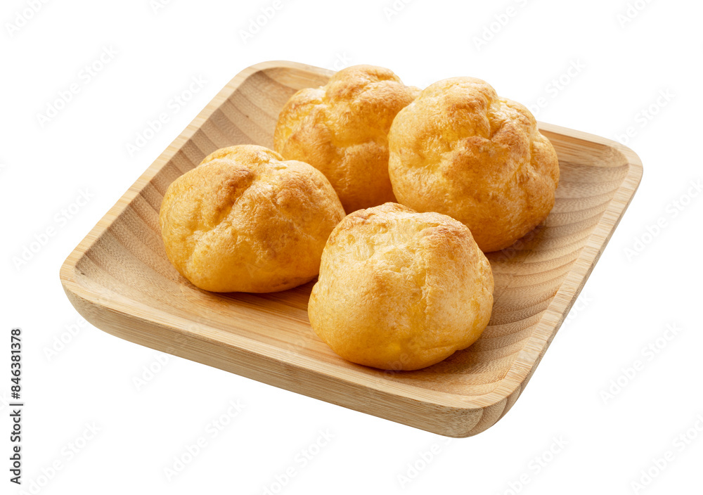 Cream puffs on a plate placed on a white background. Cream puffs on a plate placed on a white background.