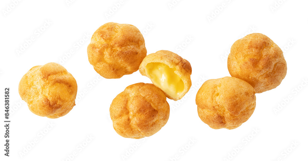 Multiple cream puffs placed on a white background. View from directly above. Multiple cream puffs placed on a white background. View from directly above.