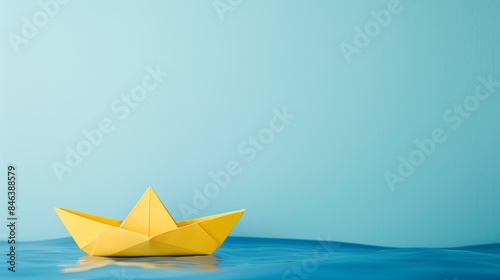 Yellow Origami Paper Boat Floating on Water, Symbol of Leadership and Direction