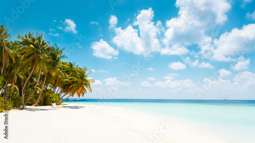 Vacation summer holidays background wallpaper - sunny tropical Caribbean paradise beach with white sand in Seychelles Praslin island Thailand style with palms