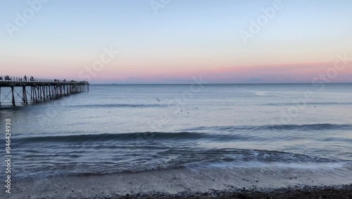 Pier and North Sea at sunset in January at Saltburn-by-the-Sea, North Yorkshire, England, United Kingdom