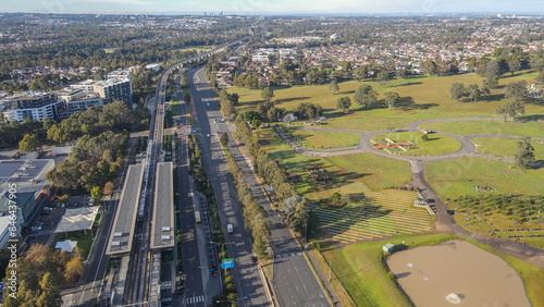 Photography Aerial drone view above Rouse Hill Station on the metro northwest railway line,