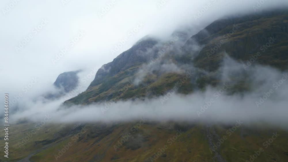 Dramatic Aerial Pullback of Scottish Highlands and Clouds Rolling Down from the Mountain Dramatic Aerial Pullback of Scottish Highlands and Clouds Rolling Down from the Mountain