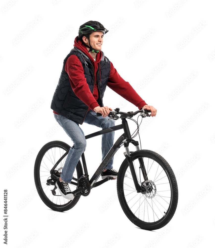 Naklejka premium Smiling man in helmet riding bicycle on white background