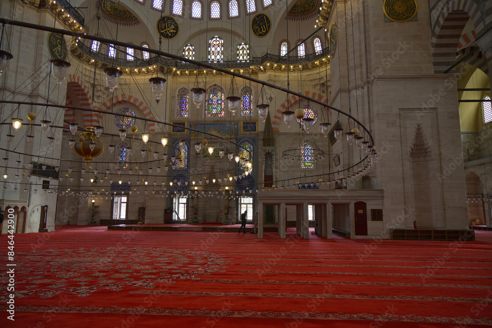 Obraz premium Interior of Suleymaniye Mosque with ornate arches and hanging lanterns. Istanbul, Turkey