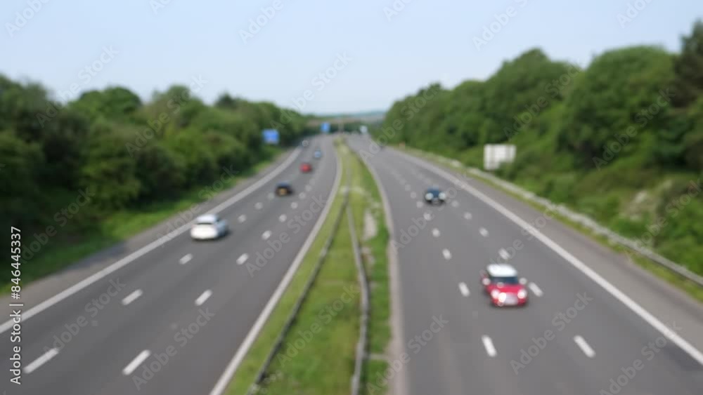 Blurred high angle view of motorway M4 in South Wales, UK. Bridge viewpoint towards West. Blurred high angle view of motorway M4 in South Wales, UK. Bridge viewpoint towards West.