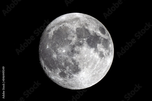 full moon against black sky showing darker clouds around it than seen on screen