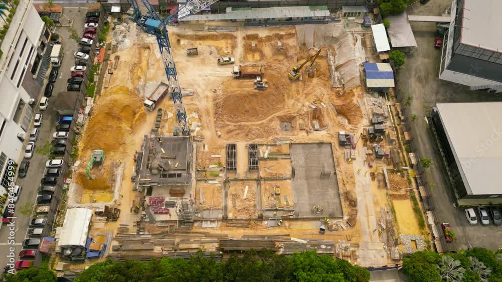 An aerial view of a construction site in the Malaysian city center. Zoomed in, 4K, sl An aerial view of a construction site in the Malaysian city center. Zoomed in, 4K, sl