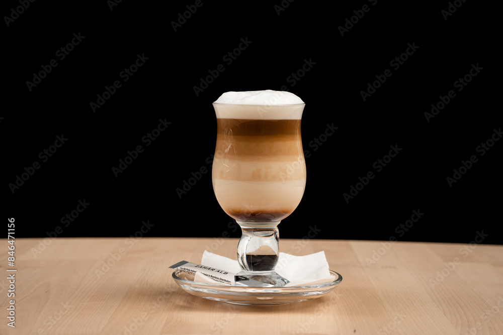 Foamy coffee in a clear glass cup Foamy coffee in a clear glass cup