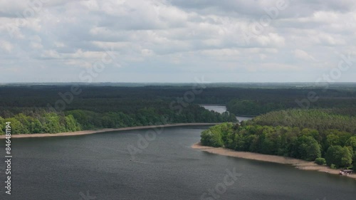 Aerial view of Wutzsee Lake surrounded by dense green forest in Lindow (Mark), Brandenburg, Germany photo