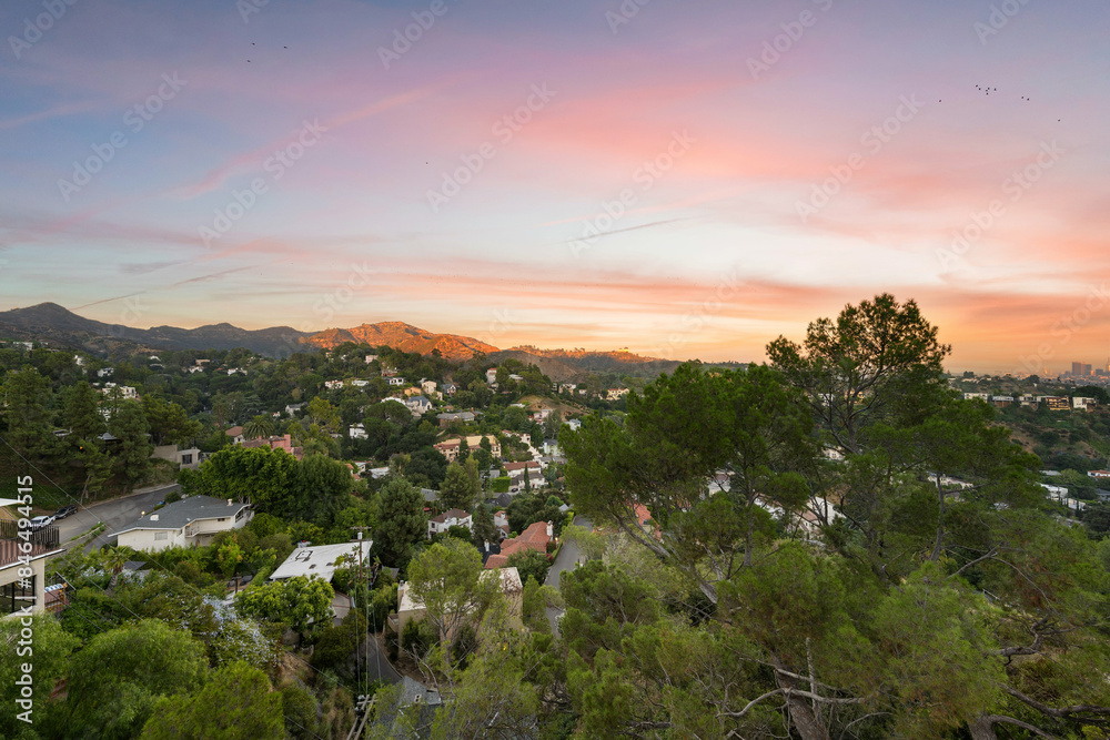 Fototapeta premium View of houses and hills at sunset. Los Angeles, California