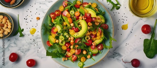 Colorful and Healthy Avocado Salad with a Variety of Fresh Ingredients on a Stylish Marble Surface, Top View
