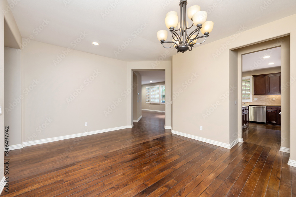 Empty room with wooden floors and a chandelier. California, USA Empty room with wooden floors and a chandelier. California, USA