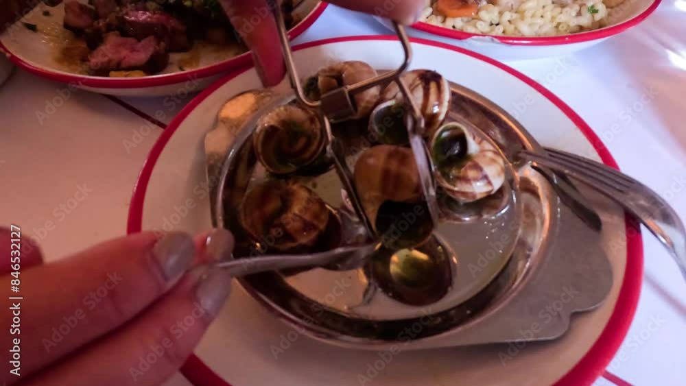 Enjoying Escargot in Paris Restaurant