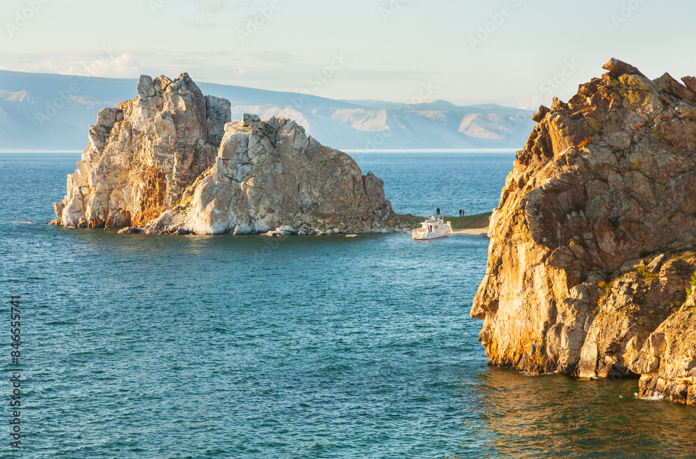 Fototapeta premium Baikal Lake in summer. Tourists sailed by ship to Olkhon Island along the Small Sea to the famous Shamanka Rock on a sunny August day. Summer outdoor recreation and water travel