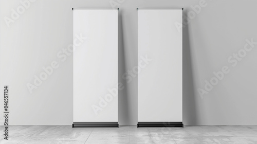 Two blank roll up banner standing on the floor, gray background, mockup template