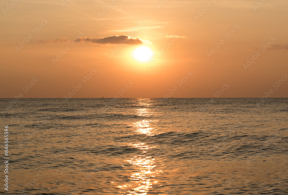 Background image of the beach in summer time. Beautiful sunrise or sunset sky over the sea at tropical beach in the morning or evening. copy space Background image of the beach in summer time. Beautiful sunrise or sunset sky over the sea at tropical beach in the morning or evening. copy space