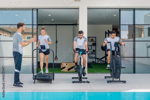 Fitness enthusiasts training at a modern outdoor gym photo