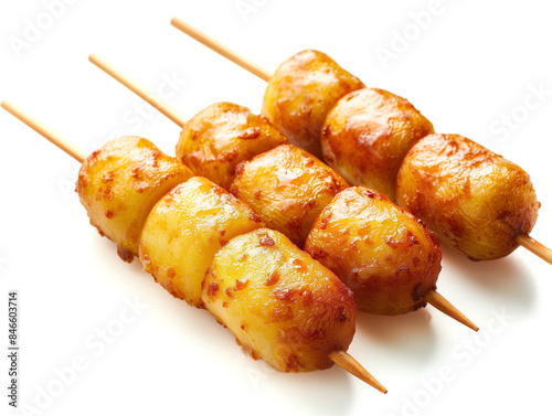 Korean-style Chunky Potato Corn Dogs with Crispy Batter and Fried Potatoes on Cream Background, Perfect for Text Placement photo