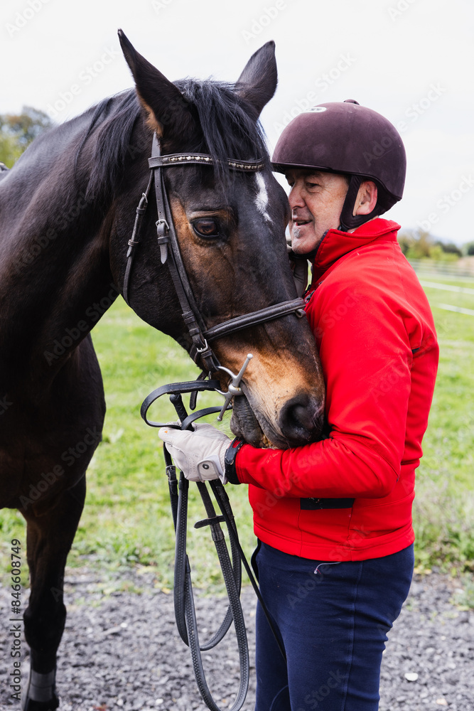 Obraz premium Retired Man Petting Horse's Head in Countryside