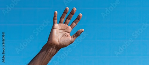 Sri Lanka's blue sky provides a vivid background for these hands with a copy space image. photo