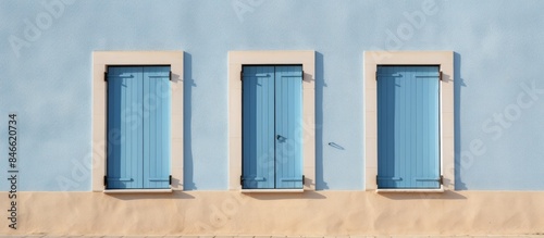 A light blue building with ...