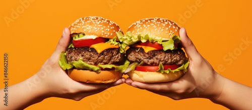 Hands holding delicious bur...