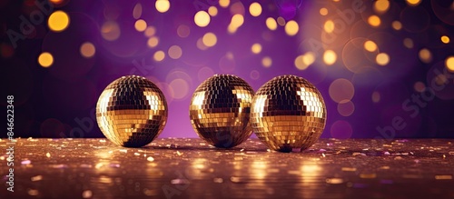 Disco balls in purple and g...