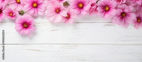 Pink flowers on a white woo...